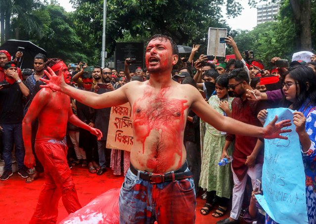 Bangladeshi artists perform during a mass demonstration in Dhaka, Bangladesh, 02 August 2024. Thousands of people took part in a nationwide prayer and student procession to protest the "massacre and mass arrests" following recent protests by the Quota Reform Movement, which is demanding reforms to the government's job quota system. Authorities in Bangladesh have announced a gradual easing of a curfew imposed on July 20 after violence erupted in Dhaka and other regions following mass protests last week, allowing offices to open and some activities to take place, and partially restoring telecommunications services. (Photo by Monirul Alam/EPA)