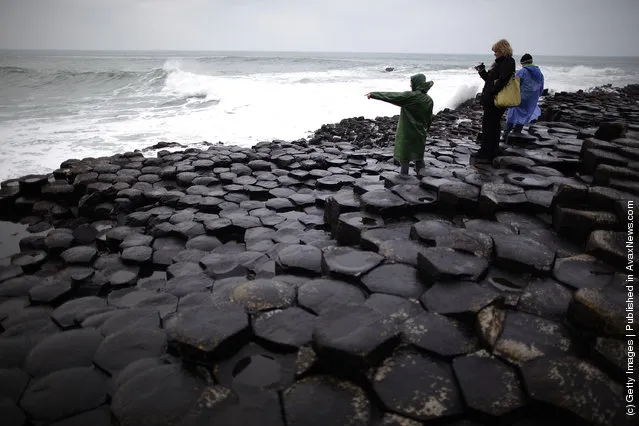 Visitors walk on the Giant's Causway in Portrush, Northern Ireland
