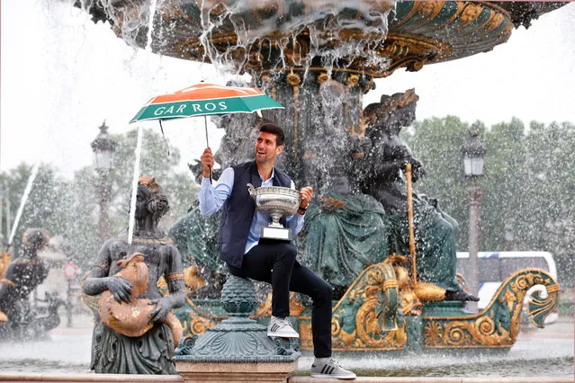 Novak Djokovic, from Serbia, poses with the French Open tennis trophy during a photo session at the Place de la Concorde, in Paris, Monday June 6, 2016. Djokovic was the winner against Britain's Andy Murray in four sets 3-6, 6-1, 6-2, 6-4. (Photo by Thibault Camus/AP Photo)