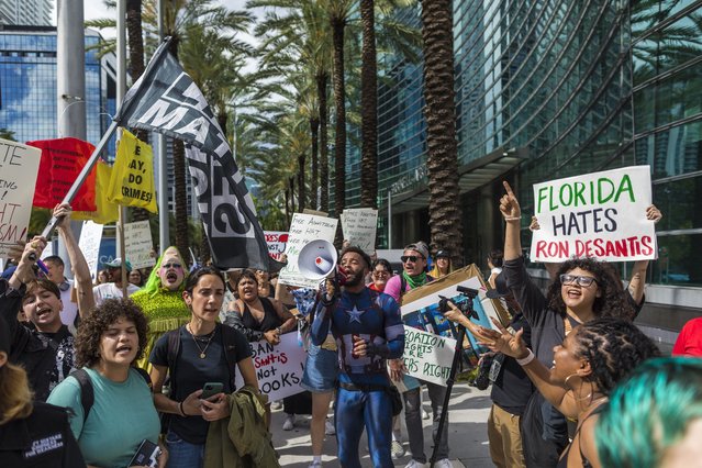 As Florida Governor Ron DeSantis holds fundraising events ahead of his presidential candidacy announcement, demonstrators gather outside the Four Season Hotel in Miami, Florida, on May 24, 2023, (Photo by Saul Martinez for The Washington Post)