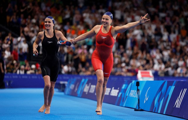 Emeline Pierre and Anaelle Roulet of France celebrate during the women's 100m backstroke on September 6, 2024. (Photo by Andrew Couldridge/Reuters)