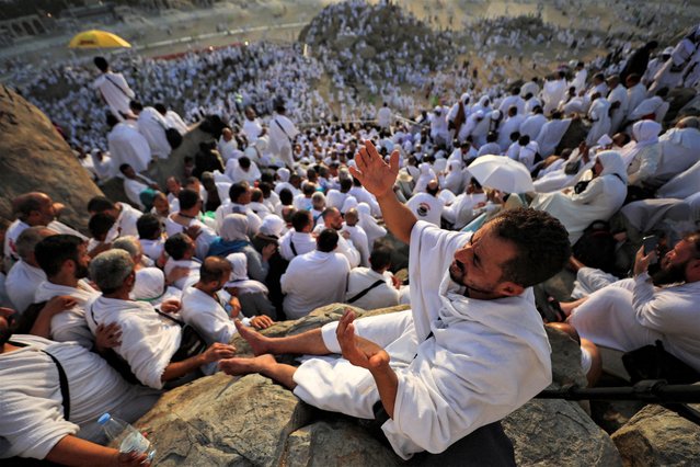 Muslim pilgrims pray on the Mount of Mercy at the plain of Arafat during the annual haj pilgrimage, outside the holy city of Mecca, Saudi Arabia on June 27, 2023. (Photo by Mohamed Abd El Ghany/Reuters)