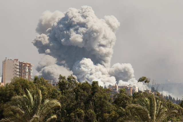 Smoke billows over southern Lebanon following Israeli strikes, amid ongoing cross-border hostilities between Hezbollah and Israeli forces, as seen from Tyre, southern Lebanon on September 23, 2024. (Photo by Aziz Taher/Reuters)