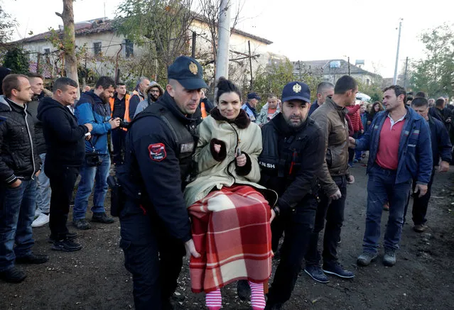 Emergency workers carry a woman in Thumane, after an earthquake shook Albania, November 26, 2019. (Photo by Florian Goga/Reuters)