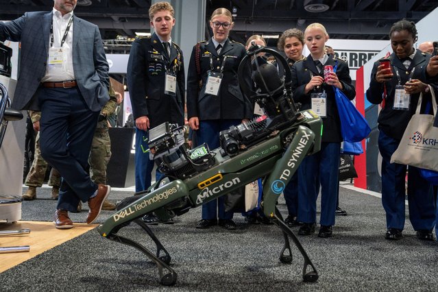 Attendees watch as a Boston Dynamics robot performs during the Association of the United States Army annual meeting and exposition at the Walter E. Washington Convention Center in Washington, on October 14, 2024. (Photo by Nathan Howard/Reuters)