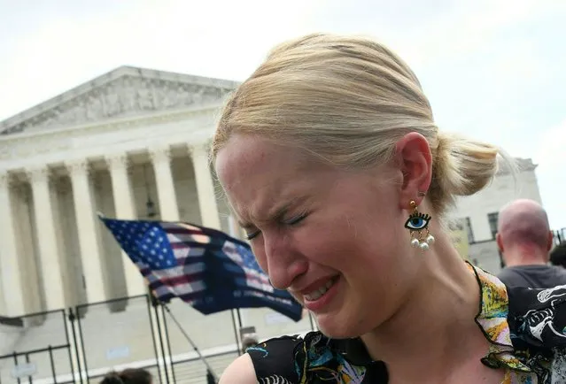 A pro-choice supporter cries outside the US Supreme Court in Washington, DC, on June 24, 2022. The US Supreme Court on Friday ended the right to abortion in a seismic ruling that shreds half a century of constitutional protections on one of the most divisive and bitterly fought issues in American political life. The conservative-dominated court overturned the landmark 1973 “Roe v Wade” decision that enshrined a woman's right to an abortion and said individual states can permit or restrict the procedure themselves. (Photo by Olivier Douliery/AFP Photo)