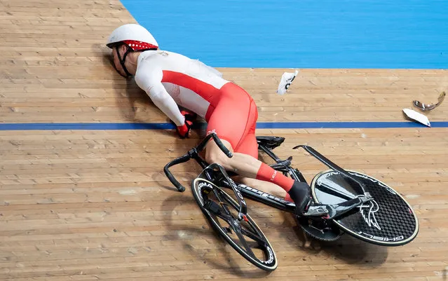 Joe Truman of Team England crashes during the Men's Track Cycling Keirin Second Round Heat One on day two of the Birmingham 2022 Commonwealth Games at Lee Valley Velopark Velodrome on July 30, 2022 on the London, England. (Photo by Justin Setterfield/Getty Images)