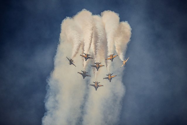 Members of South Korea's “Black Eagle” aerobatics team perform a display at the Seoul International Aerospace and Defense Exhibition (ADEX) in Seongnam, south of Seoul on October 16, 2023. (Photo by Anthony Wallace/AFP Photo)