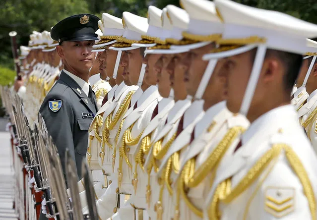 A Japan Self Defense Force officer checks an honor guard before they are inspected by new Defense Minister Tomoni Inada at the Defense Ministry in Tokyo, Thursday, August 4, 2016. (Photo by Shuji Kajiyama/AP Photo)