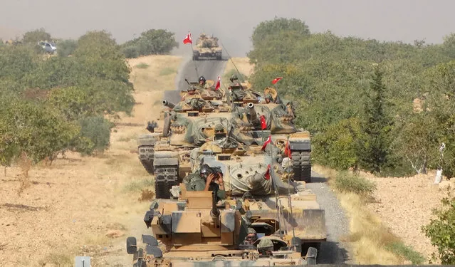 Turkish army tanks make their way towards the Syrian border town of Jarablus, Syria August 24, 2016. (Photo by Reuters/Revolutionary Forces of Syria Media Office)