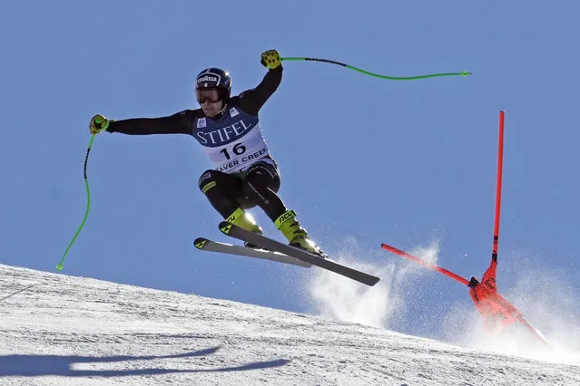 Italy's Matteo Marsaglia jumps past a flag during a men's World Cup downhill training run Wednesday, November 30, 2022, in Beaver Creek, Colo. (Photo by Robert F. Bukaty/AP Photo)