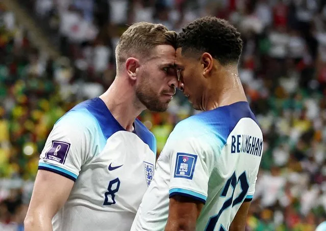 Jordan Henderson of England celebrates after scoring his team's first goal with Jude Bellingham of England during the FIFA World Cup Qatar 2022 Round of 16 match between England and Senegal at Al Bayt Stadium on December 4, 2022 in Al Khor, Qatar. (Photo by Marko Djurica/Reuters)