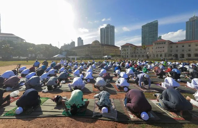 Muslims wearing protective masks practice social distancing as they attend a prayer to mark the Hajj festival, amid concerns about the spread of the coronavirus disease (COVID-19), in Colombo, Sri Lanka, August 1, 2020. (Photo by Dinuka Liyanawatte/Reuters)