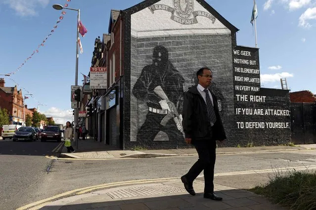 A man walks past a mural in East Belfast in Northern Ireland, September 18, 2015. (Photo by Cathal McNaughton/Reuters)