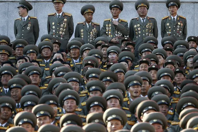 Senior North Korean military officers wait for the start of the parade celebrating the 70th anniversary of the founding of the ruling Workers' Party of Korea, in Pyongyang October 10, 2015. (Photo by Damir Sagolj/Reuters)