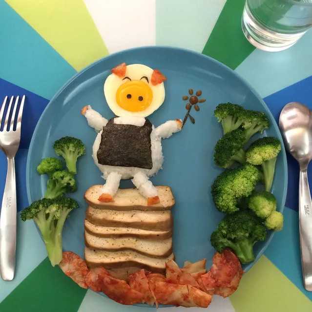 Annes egg art a smiling pig standing on a tower of toast with a sushi roll apron. (Photo by Anne Widya/Caters News)