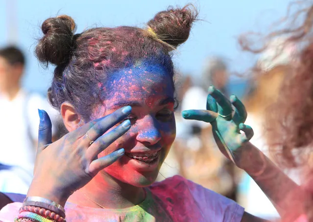 A participant covered in coloured powder attends the “Saida in Color” event, part of the Sidon International Festival, southern Lebanon September 25, 2016. (Photo by Ali Hashisho/Reuters)