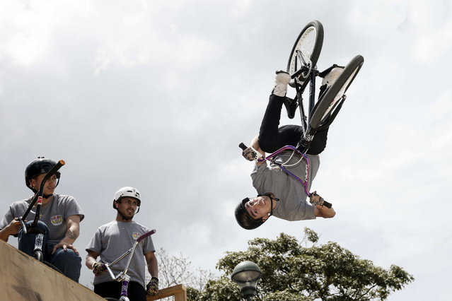 A person performs a bicycle stunt during the Red Bull Pura Calle (Red Bull Pure Street) event held to celebrate World BMX Freestyle Day, in San Jose, Costa Rica, 20 July 2025. (Photo by Jeffrey Arguedas/EPA)