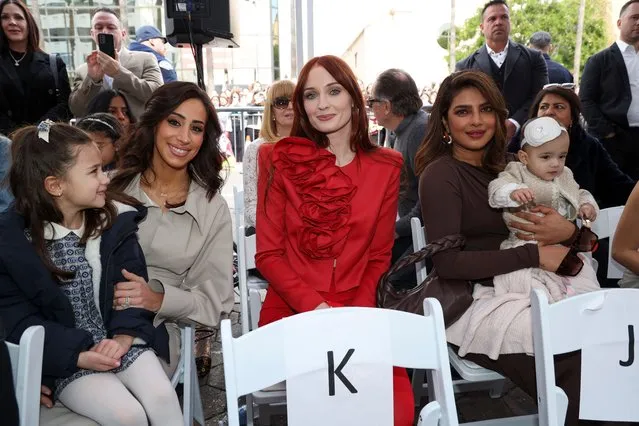 American reality television personality Danielle Jonas, Kevin Jonas' wife, English actress Sophie Turner, Joe Jonas' wife, and Indian actress Priyanka Chopra, Nick Jonas' wife, pose during the Jonas Brothers' star unveiling ceremony on The Hollywood Walk of Fame in Los Angeles, California, U.S., January 30, 2023. (Photo by Mario Anzuoni/Reuters)