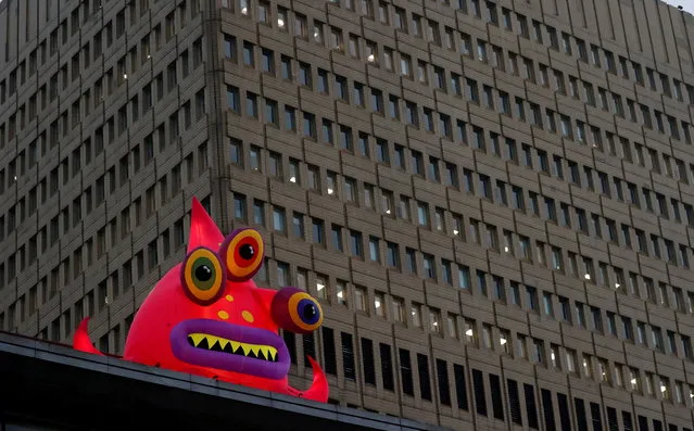 A giant inflatable monster, one of a collection of monsters that have appeared to mark Halloween is seen in front of an office block in Manchester, Britain, October 26, 2020. (Photo by Phil Noble/Reuters)