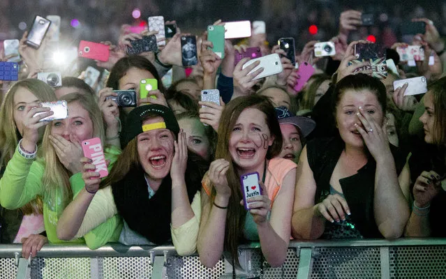 Young fans of Canadian singer Justin Bieber attend his concert as part of the “Believe Tour” at Telenor Arena in Fornebu, Norway on April 16, 2013. (Photo by Daniel Sannum Lauten/AFP Photo)