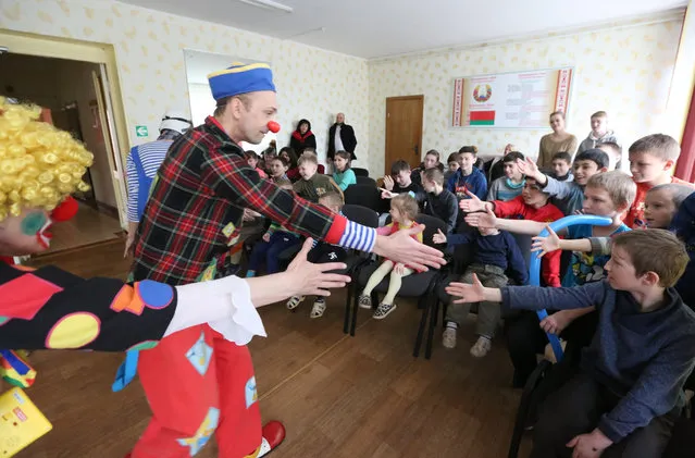 Clowns perform in the children's social shelter during the first clown festival in Belarus in Bobruisk, some 150 km from Minsk, Belarus, 01 April 2018 (issued 05 April). About 60 participants from Belarus and Russia took part in the event. The first clown festival in Belarus took place in Bobruisk on the April Fool's Day on 01 April 2018. About 60 clowns from Belarus and Russia gathered to entertain spectators. For 1 day Bobruisk became a capital of Jokes and Humour. Theaters of clownery, mime-theaters, individual performers of humorous genre, stilts and hospital clowns performed on a stage of the Palace of Arts. Most of the participants have other jobs and practice clownery as a hobby. Clown Betty says she works as a clown because she loves childrens laughter and emotions. Before the show, clowns visited Bobruisk children's hospital and children's social shelter to make fun and bring laughter to it's little inhabitants. “Clown-Show 2018” was held in a city with over 200 000 polulation and is planned to become annual and to spread it's geography of performes. (Photo by Tatyana Zenkovich/EPA/EFE)