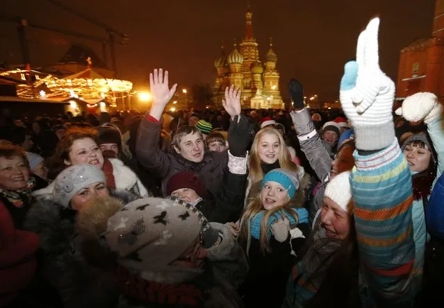 Revellers celebrate ahead of New Year's Day in Red Square in Moscow December 31, 2014. (Photo by Tatyana Makeyeva/Reuters)