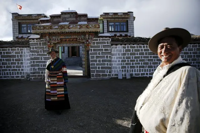Tibetan herdsman Lob Sang (R) and his wife Lomo smile in front of their home after being visited by foreign reporters on a government organised tour in Damxung county of the Tibet Autonomous Region, China November 18, 2015. (Photo by Damir Sagolj/Reuters)