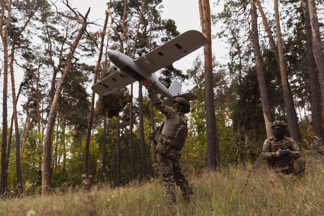 Ukrainian soldiers prepare to launch an Avenger UAV drone in Ukraine's Kharkiv region, Wednesday, September 24, 2025. (Photo by Yevhen Titov/AP Photo)