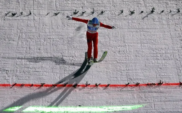 Dimitry Vassiliev from Russia lands during the final jumping of the four-hills ski jumping tournament in Bischofshofen, January 6, 2015. (Photo by Dominic Ebenbichler/Reuters)