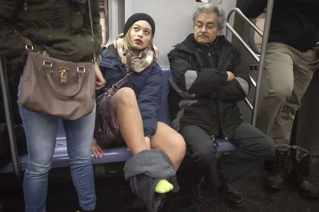 A participant takes part in the “No Pants Subway Ride” in the Manhattan borough of New York January 11, 2015. (Photo by Carlo Allegri/Reuters)