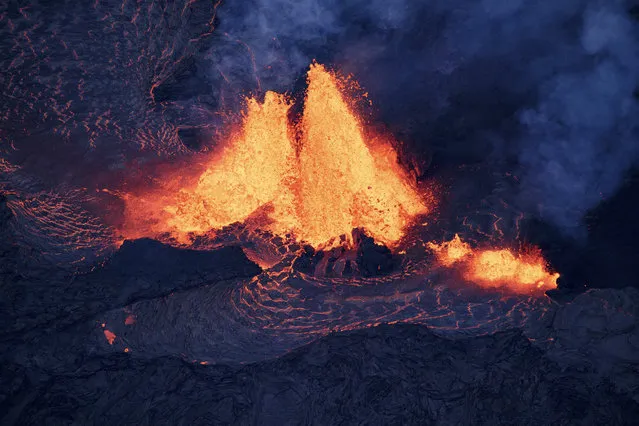 A noticeable increase in volume of lava being produced by fissure 7, has huge rivers of lava snaking its way toward the sea, and a massive flow headed toward the Puna Geothermal Venture facility, Pahoa, Hawaii, USA 27 May 2018. Two existing ocean entries are still active, fed by fissure 22, but have slowed substantially.  Additionally, the area around fissure 17 may have reactivated, as several glowing spots were observed. (Photo by Bruce OmoriEPA/Paradise Helicopters)