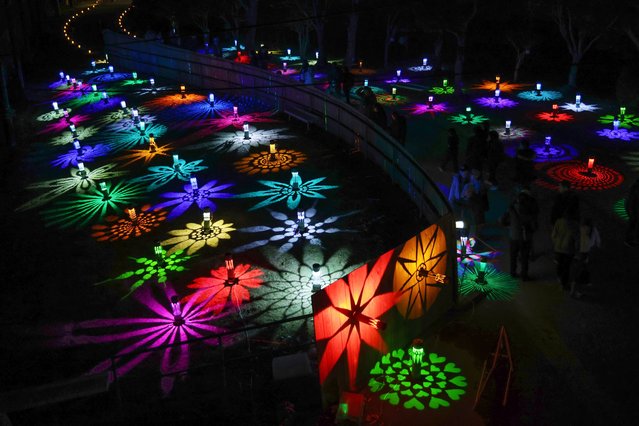 Colorful lantern lights projected onto the ground and other surfaces on December 7, 2025 in Agui, Aichi, Japan. (Photo by The Asahi Shimbun via Getty Images)