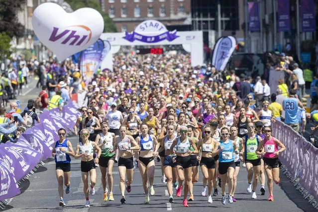 People participating in the Vhi Women's Mini Marathon in Dublin, Ireland on Sunday, June 4, 2023. (Photo by Tom Honan for The Irish Times)