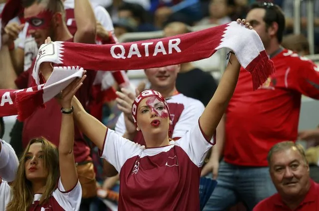 A fan of Qatar cheers before their semi-final match against Poland at the 24th Men's Handball World Championship in Doha January 30, 2015. (Photo by Mohammed Dabbous/Reuters)