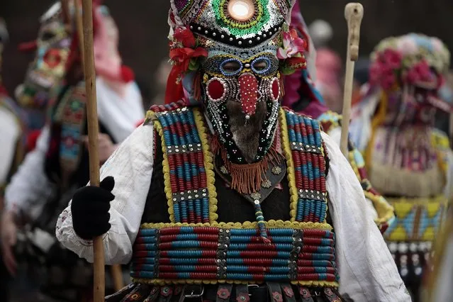 A masked Bulgarian dancer takes part in the second competition day of the 24th International Festival of Masquerade Games “Surva” in the town of Pernik, Bulgaria Saturday, January 31, 2015. (Photo by Valentina Petrova/AP Photo)