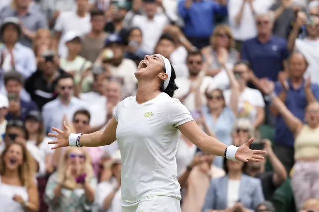 Tunisia's Ons Jabeur celebrates after beating Kazakhstan's Elena Rybakina to win their women's singles match on day ten of the Wimbledon tennis championships in London, Wednesday, July 12, 2023. (Photo by Kirsty Wigglesworth/AP Photo)