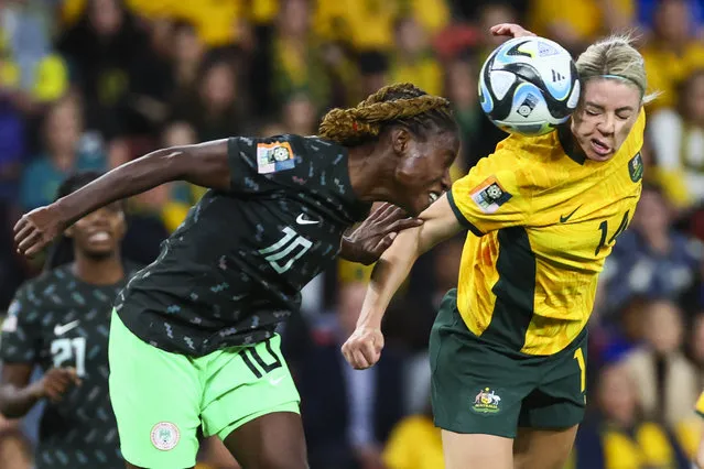 Australia's Alanna Kennedy, right, goes for a header with Nigeria's Christy Ucheibe during the Women's World Cup Group B soccer match between Australia and Nigeria In Brisbane, Australia, Thursday, July 27, 2023. (Photo by Tertius Pickard/AP Photo)