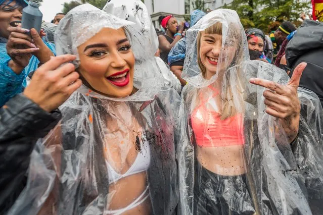 The rain comes but fails to dampen spirits too much during the Notting Hill Carnival in London, Britain on August 26, 2018. (Photo by Guy Bell/Rex Features/Shutterstock)