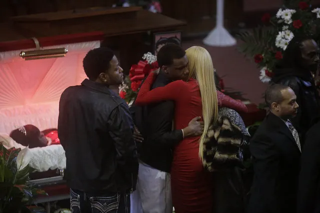 LaTisha Jones (blonde hair) receives a hug as she attends the funeral for her mother Bettie Jones at New Mount Pilgrim Missionary Baptist Church January 6, 2016 in Chicago, Illinois. Bettie Jones, 55 and Quintonio LeGrier, 19 were both killed last month during a police involved shooting where officers were responding to a domestic dispute call after LeGrier pulled a bat on his father. Police later issued a statement saying Jones was accidentally killed. (Photo by Joshua Lott/Getty Images)