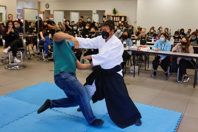 Six degree black belt aikido instructor Tam Ha teaches self-defense to students at Advance Beauty College during the outbreak of the coronavirus disease (COVID-19) in Garden Grove, California, U.S., April 12, 2021. (Photo by Mike Blake/Reuters)