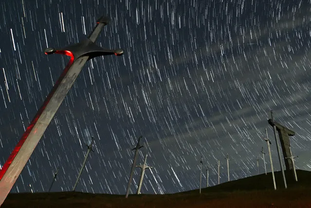 A view shows stars and meteor trails in the night sky above the Battle of Didgori memorial complex during the Lyrid meteor shower in Didgori, Georgia on April 22, 2023, in this composite image of 28 separate photographs. (Photo by Irakli Gedenidze/Reuters)