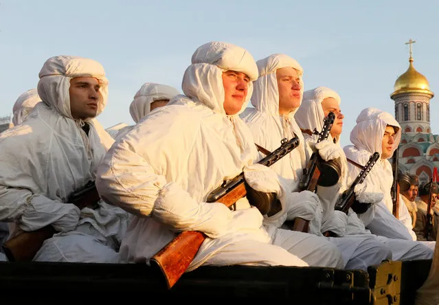 Participants sit in a truck during preparations for a military parade in Red Square in Moscow on November 7, 2018. (Photo by Maxim Shemetov/Reuters)