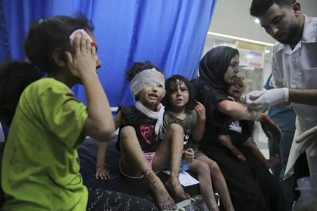 Palestinian children wounded in Israeli strikes are brought to Shifa Hospital in Gaza City on Wednesday, October 11, 2023. (Photo by Ali Mahmoud/AP Photo)