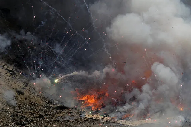 Fireworks confiscated from illegal vendors before New Year holidays are destroyed by police, in Lima, Peru, December 29, 2016. (Photo by Guadalupe Pardo/Reuters)