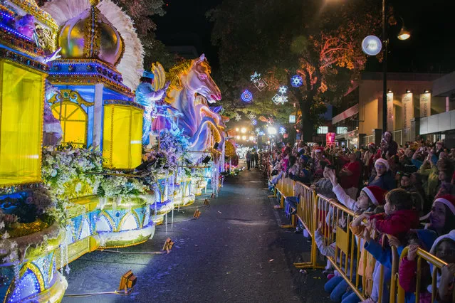 People attend the Light Festival parade in the main streets of San Jose, Costa Rica on December 15, 2018. (Photo by Ezequiel Becerra/AFP Photo)
