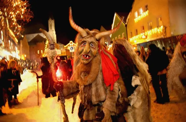 Locals dressed as “Perchten”, a traditional demonic creature in German and Austrian Alpine folklore, parade through the town center during the annual “Rauhnacht” gathering on January 5, 2017 in Waldkirchen, Germany. (Photo by Johannes Simon/Getty Images)