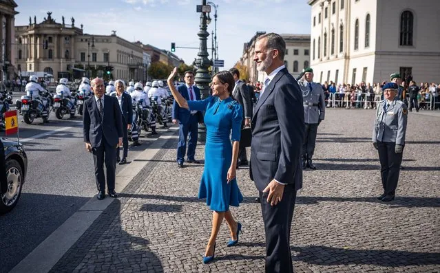 King Felipe VI and Queen Letizia of Spain walk to their carriage after the wreath-laying ceremony at the Neue Wache and wave to onlookers in Berlin on October 17, 2022. The Spanish royal couple is in Germany for a three-day state visit. (Photo by Michael Kappeler/dpa-Pool/dpa via AP Photo)