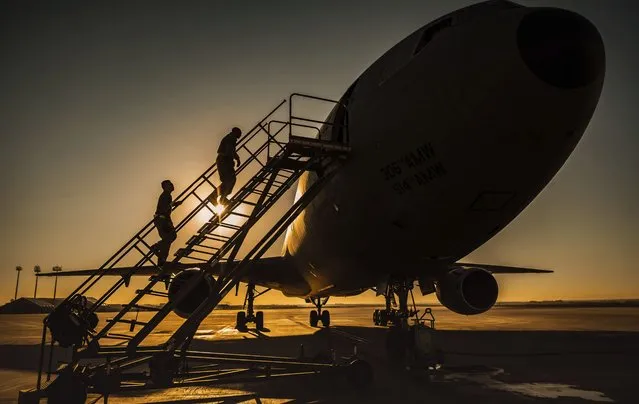 In this January 5, 2021 photo from the U.S. Air Force, two KC-10 Extender crew chiefs board the aircraft at Al-Dhafra Air Base, United Arab Emirates. An Air Force KC-10 Extender that flew out of Al-Dhafra Air Base in the United Arab Emirates on Sunday, May 2, 2021, used the call sign “PIKLRICK” on a mission that saw it fly east out over the Gulf of Oman, according to flight-tracking data. The call sign appears to be a nod to an episode of the cartoon “Rick and Morty” in which one of the titular characters turns himself into a pickle to escape a family therapy session. (Photo by Staff Sgt. Trevor T. McBride/U.S. Air Force via AP Photo)