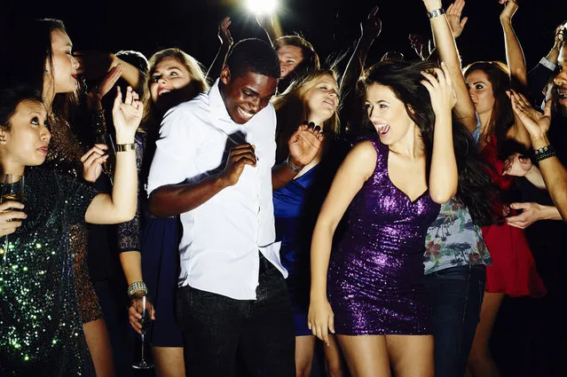 Group of friends dancing and having fun together. (Photo by Flashpop/Getty Images)
